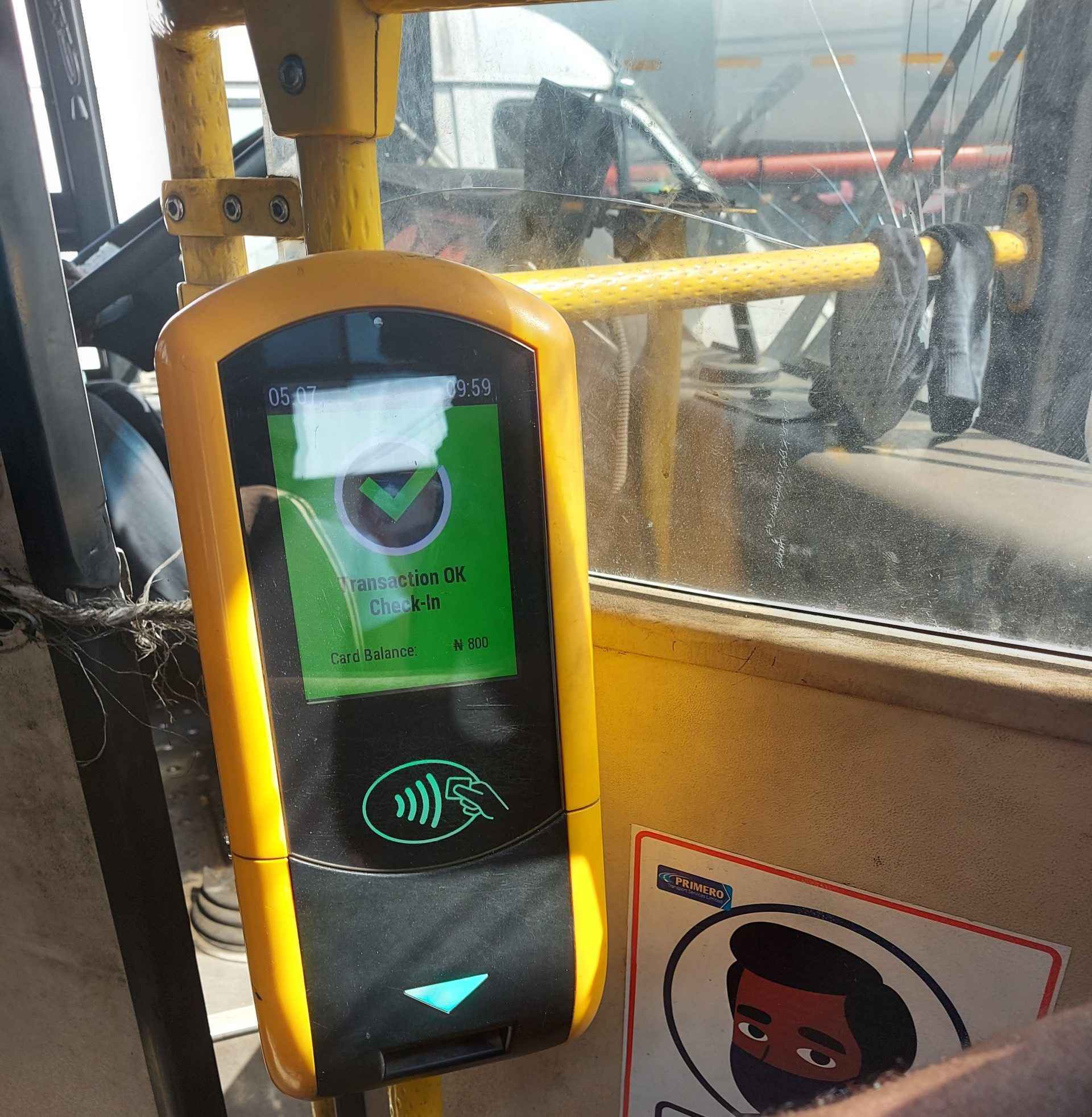 In a BRT bus, the cowry card validator displays a successful payment.