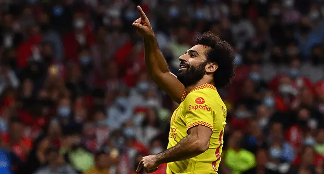 Liverpool's Egyptian forward Mohamed Salah celebrates after scoring his team's third goal during the UEFA Champions League Group B football match between Atletico Madrid and Liverpool at the Wanda Metropolitano stadium in Madrid on October 19, 2021. GABRIEL BOUYS / AFP